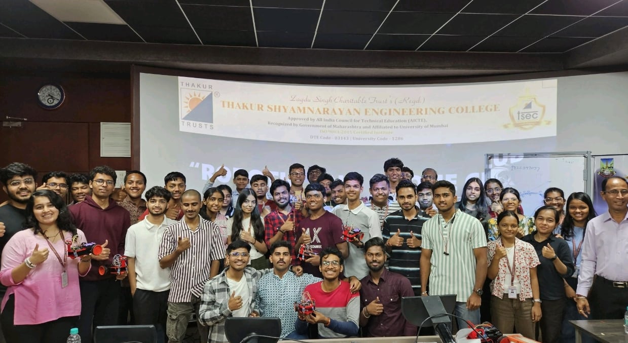 Robotics club members holding built robots under the Thakur Shyamnarayan Engineering College banner